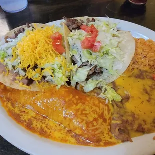 #8 lunch special; enchilada, tostada, taco, rice and beans. It&apos;s huge!