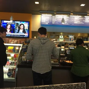 people at the counter in a restaurant