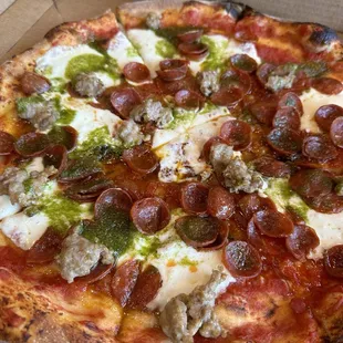 pesto, sausage, pepperoni pizza