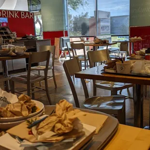 All tables around us had dirty trays/dishes on them, and dirty dishes piled up near the garbage can.