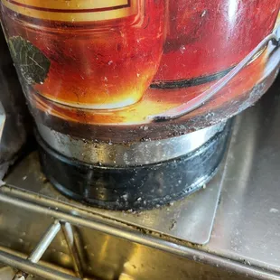 Grunge around base of tea dispenser