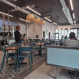 View of the dining area. No rugs, no curtains to abate the din.
