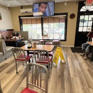 people sitting at tables and eating