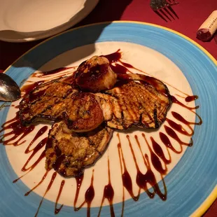 Scallops in a demi glacé sauce appetizer