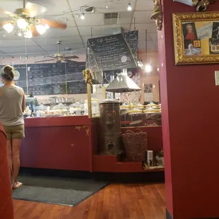 a woman standing in front of a counter