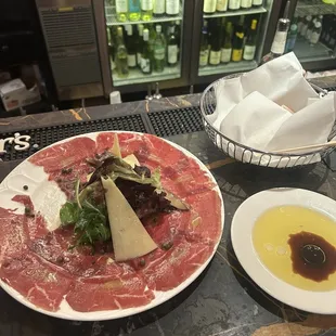 Beef carpacio and fresh bread