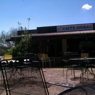 Sitting in the shade outside. Lots of birds nearby, and a hash menu from Amsterdam inside.