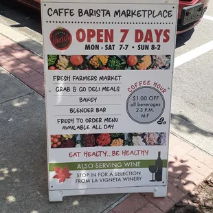 open 7 days sign on sidewalk