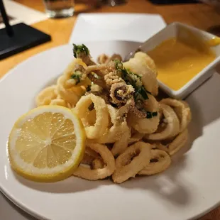 a plate of squid and lemon