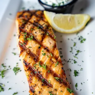 grilled salmon with a side of sour cream