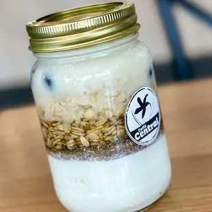 Chia Jar: overnight oats, yogurt, chia seeds, honey,  fresh mango &amp; blueberries, almond milk. YUM!