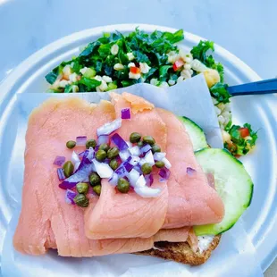a plate of food with salmon and vegetables