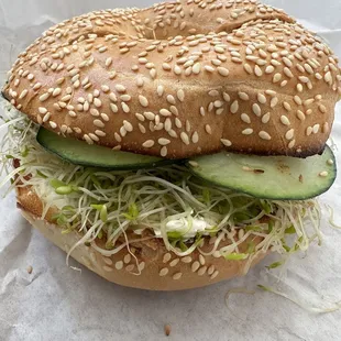 DIY bagel - cream cheese, cucumbers, and sprouts