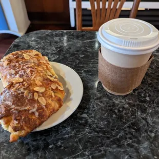 a pastry and coffee on a table