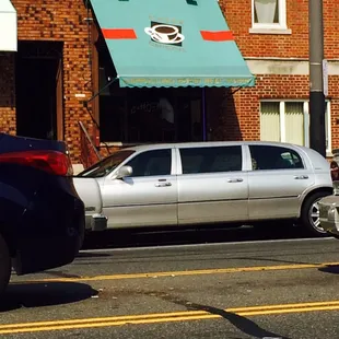 a car parked in front of a coffee shop