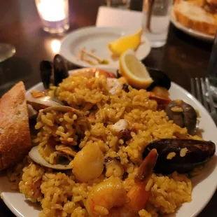 Seafood paella: mussels,  clams, octopus, scallops and shrimp and saffron rice.