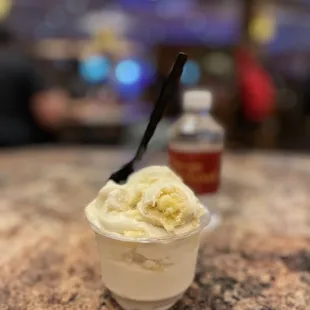 a cup of ice cream with a spoon