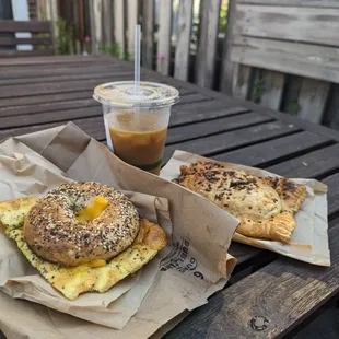 everything bagel with egg and cheese, iced coffee, pierogi hand pie