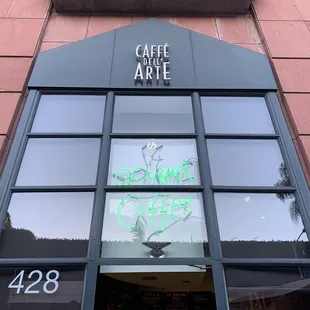 the entrance to a coffee shop
