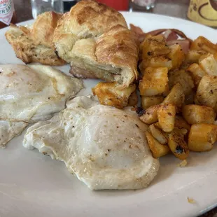 Breakfast platter over easy, home fries, bacon and croissant