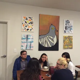 a group of people sitting around a table