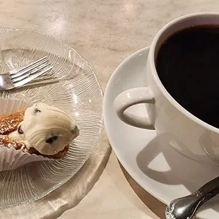 Large coffee and cannoli