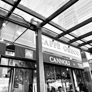 a black and white photo of a coffee shop