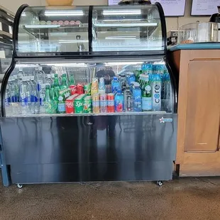 a refrigerated display of beverages