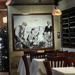 a black and white photo of a family in a wine cellar