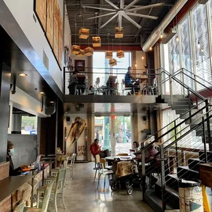 people sitting at tables in a coffee shop