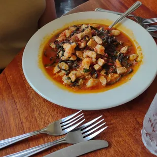 a plate of food on a wooden table