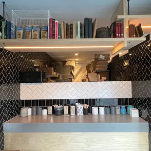 the counter and shelves of a coffee shop