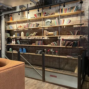 a coffee shop with shelves of books