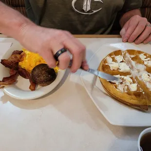a man eating breakfast at a restaurant