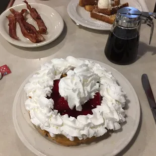 Belgian waffle with strawberries and whipped cream