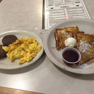 Greasy eggs and hockey puck sausage.