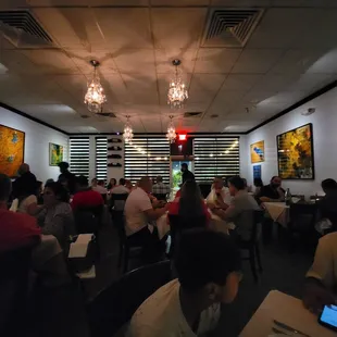 a large group of people sitting at tables