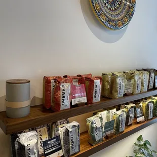 a variety of coffees on a shelf