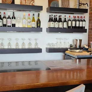 a bar with shelves of liquor