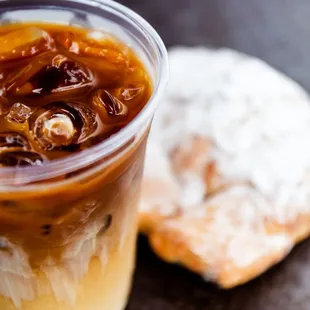 a cup of iced coffee and a donut