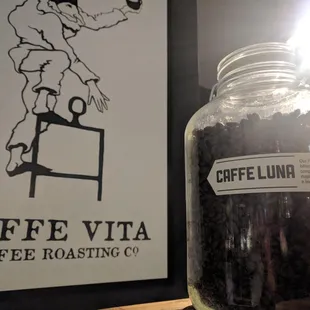 a jar of coffee beans on a table