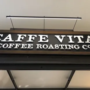 a sign above a coffee roasting co