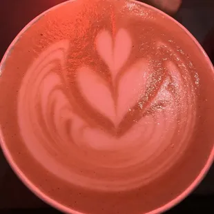 a cup of coffee with a heart drawn in it