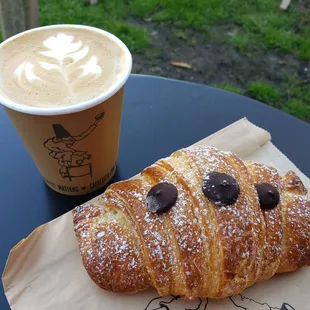 a pastry and a cup of coffee