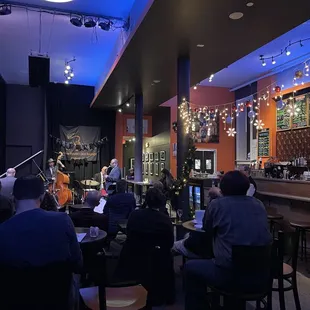 a group of people sitting at a bar
