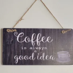 a sign hanging on a wall