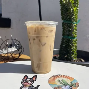 Iced caramel latte with oat milk.  2 cute Caffeine &amp; Dreams stickers.