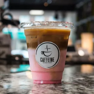 a cup of iced coffee on a counter