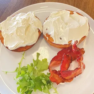 Toasted bagel with cream cheese and bacon