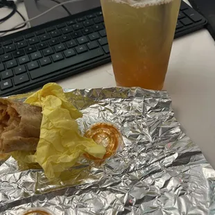 Potato chorizo burrito w salsa, iced green tea with passion fruit and guava